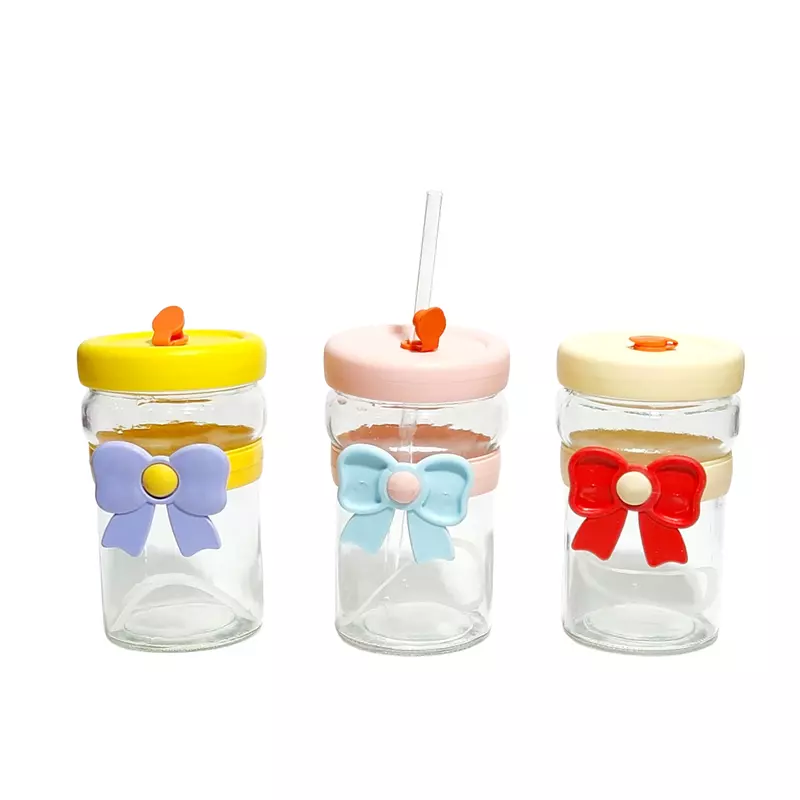 Tumblers With Bow-Shaped Silicone Sleeves and Lids.